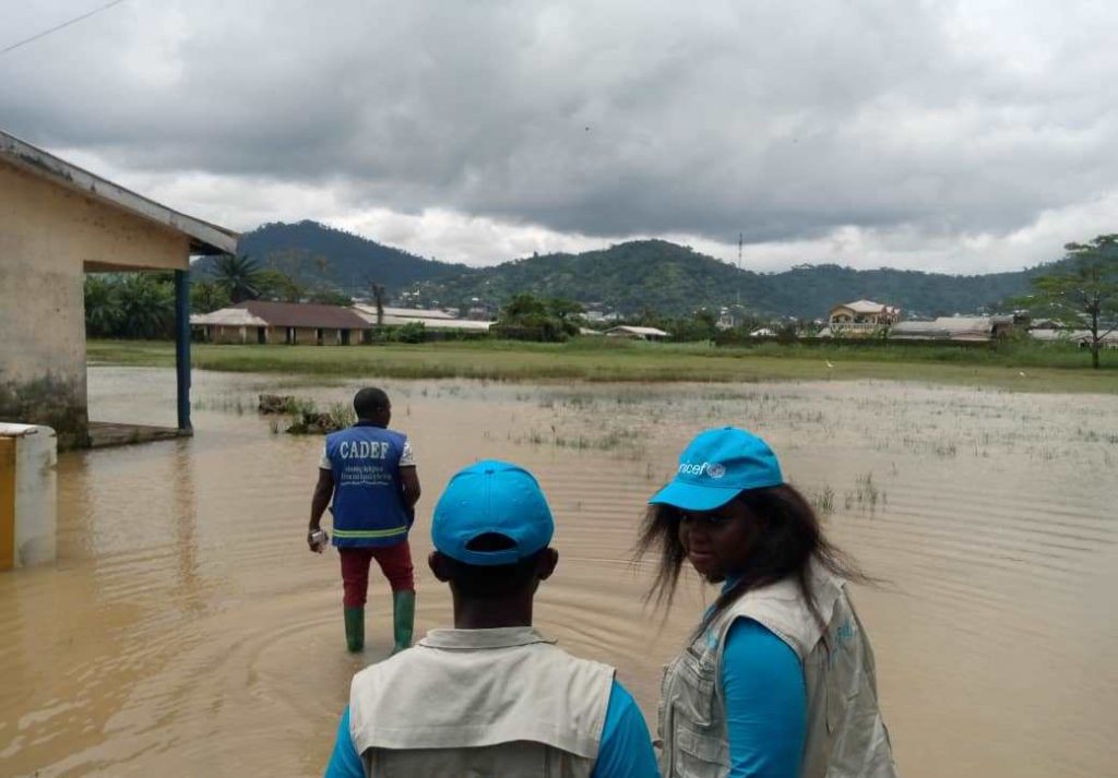 CADEF and UNICEF personnel at a flood-affected school